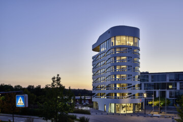 The impressive architecture of the Design Hotel Campus at Home in the evening.