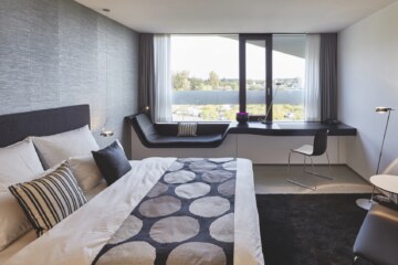 Sleeping area in one of the double hotel rooms of the modern accommodation near Munich.